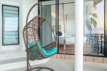 interior design bedroom with Swing chair ocean sunset lightning