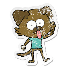 distressed sticker of a cartoon dog with tongue sticking out