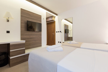 Fototapeta na wymiar Interior of a modern new hotel bedroom