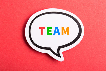Team Speech Bubble Isolated On Red