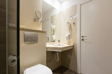 Hotel bathroom interior with shower cabin