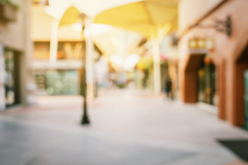 Vintage tone blurred defocused day of crowd people in walking street festival and shopping mall.