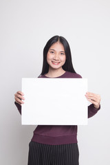 Naklejka premium Young Asian woman with white blank sign.