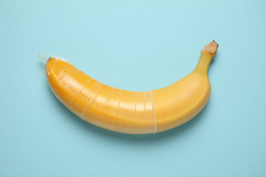 Yellow banana with condom, concept of protected sex.