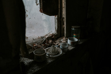 Fototapeta na wymiar Old trinkets in abandoned house