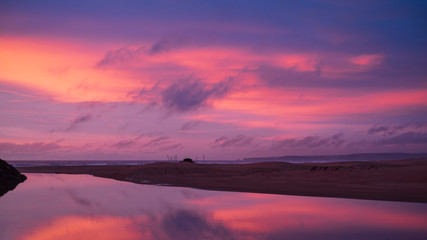 Purple sunset over coastline