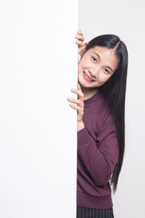 Young Asian woman with blank sign.