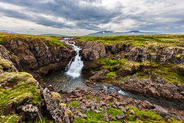 Fototapeta na wymiar Wild landscape of rocky lands and rivers in Vesturland region of Iceland along Laxardalsvegur road.
