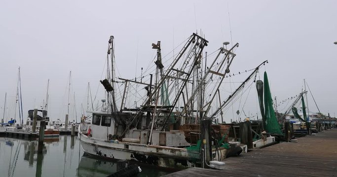 Corpus Christi Texas fishing trawler boats. South Texas tourism travel destination. Waterfront marina, port harbor and scenic byway.  Humid subtropical climate makes a year round vacation city.