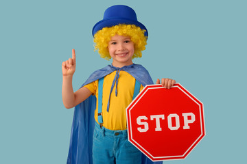 Little boy with a stop sign. Space for text