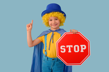 Little boy with a stop sign. Space for text