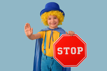 Little boy making a stop gesture. Space for text