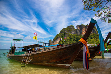 Traditional boat Thailand on the coast of a tropical island