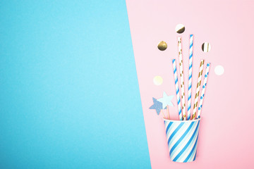 Paper cups cocktail straws. Universal modern trend concept background of a holiday, rest, party, beach two colors. Horizontal, copy space. Flat lay