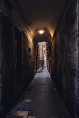 Fototapeta na wymiar Narrow streets of Genoa city in Italy