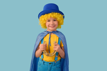 Smiling child holding a horseshoe