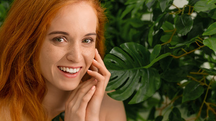 Young woman with perfect smile with on green nature background