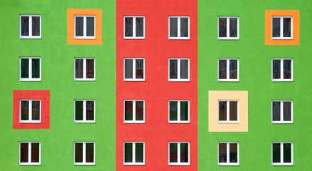 Obraz premium Bright facade, residential building with large Windows