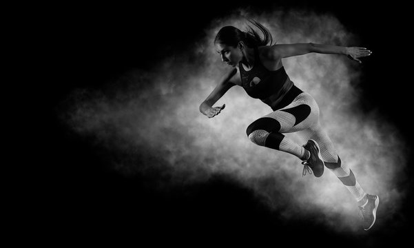 Woman sprinter leaving starting