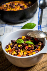Chili corn carne on wood table