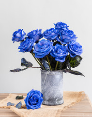 Blue roses in a vase on the table