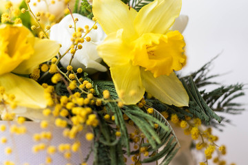 Colorful spring flowers bouquet. Narcissus, mimose