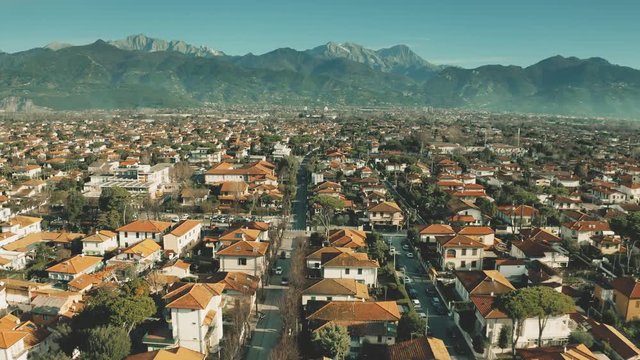 Low altitude aerial view of luxury villas and streets of Forte dei Marmi, Italy