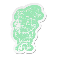 happy cartoon distressed sticker of a man wearing santa hat