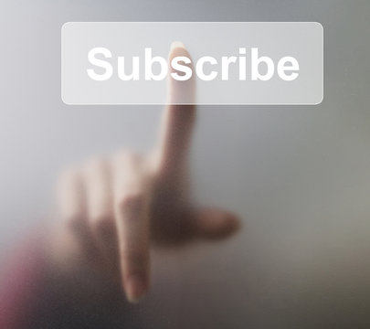 Woman pressing Subscribe button on grey background