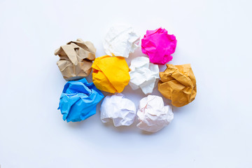 Colorful crumpled paper ball isolated on white.