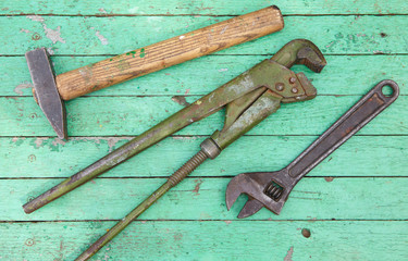 Set of old tools on wooden background