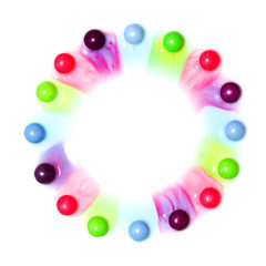 The candies are dissolving in the water and are making a colorful show. 