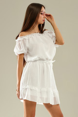 Slim young woman in white dress and summer time 