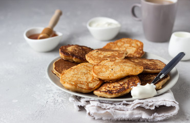 Buckwheat pancakes with honey and sour cream. Breakfast or brunch. Gluten free pancakes.
