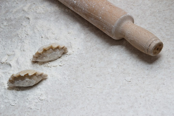 Appetizing dumplings, vareniki, ravioli, momo close-up. Boiled dough with filling. Traditional dish of Ukraine, Italy, Asia. Dumplings with meat, fish, vegetables. A hearty breakfast, lunch, dinner.