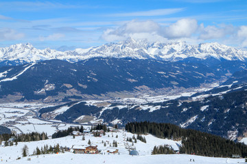 A picture from the ski resort in the austrian Alps. Snow and weather are perfect, slopes are empty. Skiing is passion in these conditions. The mountains around are great visible. 