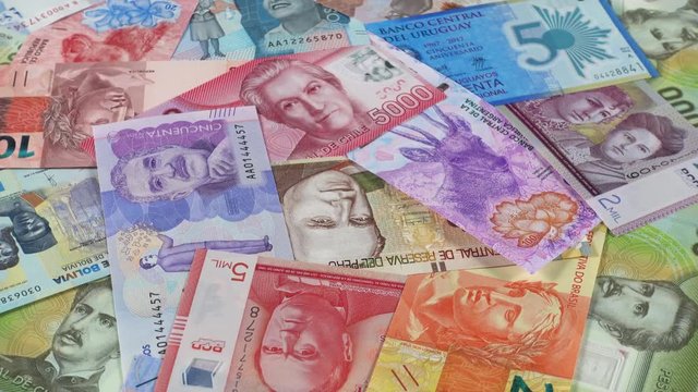 South America currency notes rotating. South American money. Low angle. 4K stock video footage