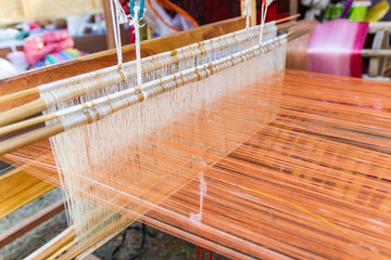 Weaving equipment Household weaving - Detail of weaving loom for homemade silk Used for silk weaving or textile production of Thailand 