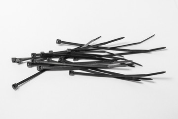 The bunch of black nylon ties. Plastic screeds.