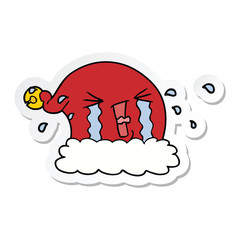sticker of a cartoon christmas hat crying