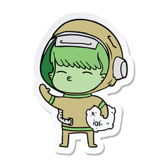 Obraz premium sticker of a cartoon curious astronaut carrying space rock