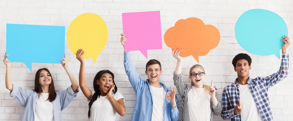 Great ideas. Teenagers holding speech bubbles, crop