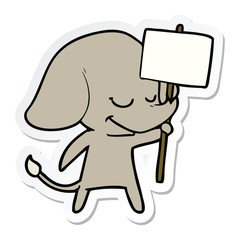 sticker of a cartoon smiling elephant with placard