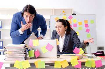 Two colleagues employees working in the office 