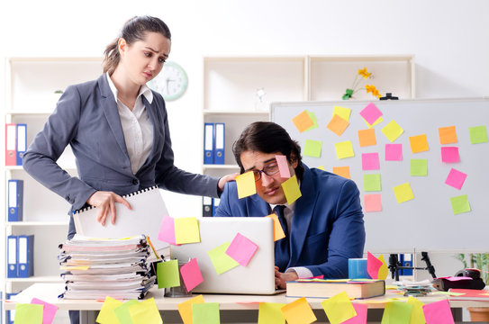 Two colleagues employees working in the office 