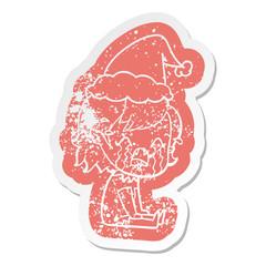 cartoon distressed sticker of a crying vampire girl wearing santa hat