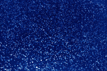 blue color abstract bokeh glitter light background. defocused circle sparkle effect glamour magic decoration for background and wallpaper template.