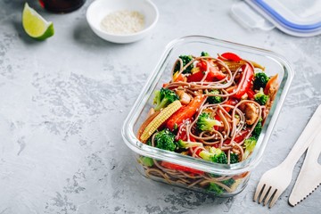 Chicken teriyaki stir fry meal prep containers with broccoli, carrots, rice or soba noodles