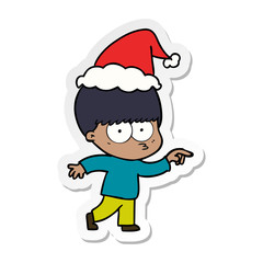 nervous sticker cartoon of a boy wearing santa hat