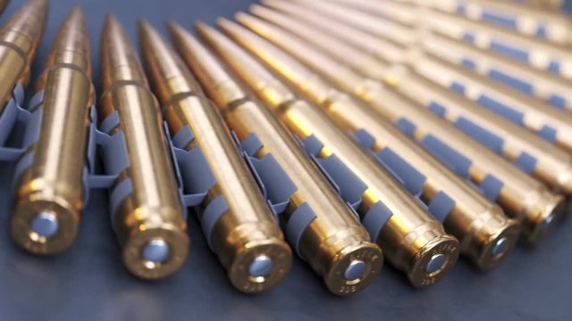 Sniper or machine gun ammo belts on a production line. Deadly ammunition.